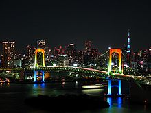 220px-Rainbow_colored_Rainbow_Bridge_at_night